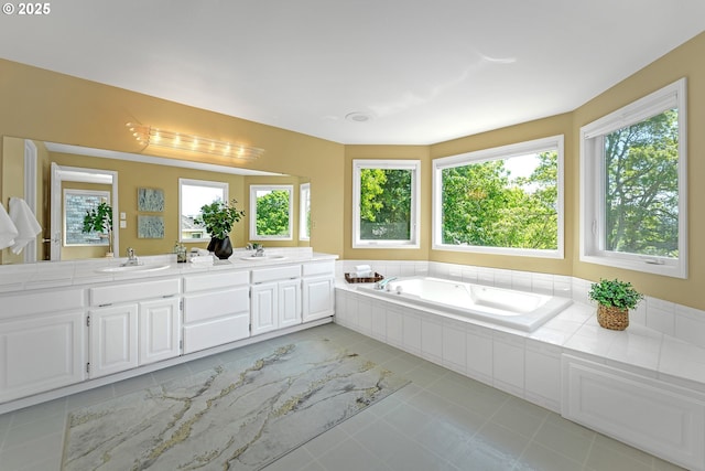 13055 Princeton Ct, Lake Oswego, OR 97035 - bathroom featuring double vanity, a garden tub, and tile patterned flooring
