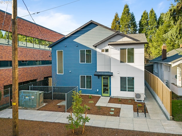 1321 NE 46th Ave Unit 3, Portland, OR 97213 - rear view of house with a fenced backyard