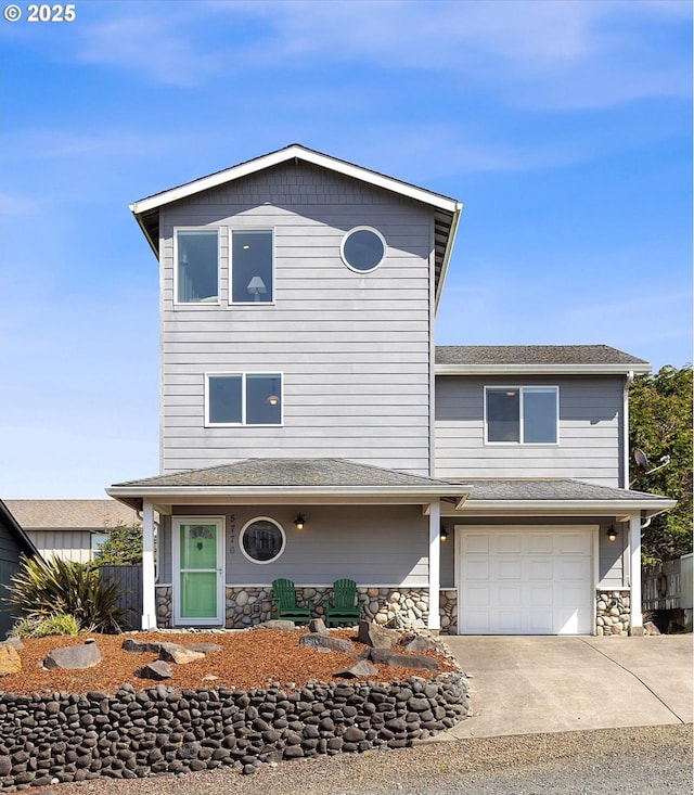 5776 NW Keel Ave, Lincoln City, OR 97367 - view of front of home with a garage, driveway, and stone siding