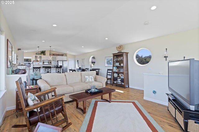 5776 NW Keel Ave, Lincoln City, OR 97367 - living area featuring recessed lighting, light wood finished floors, vaulted ceiling, and baseboards