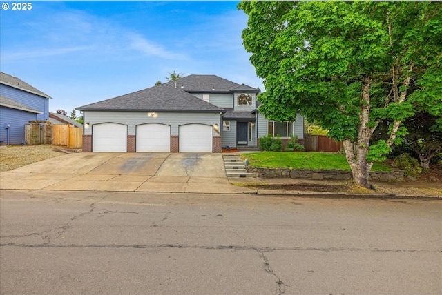 18930 Highland Dr, Oregon City, OR 97045 - traditional-style house with a garage, driveway, brick siding, and a shingled roof