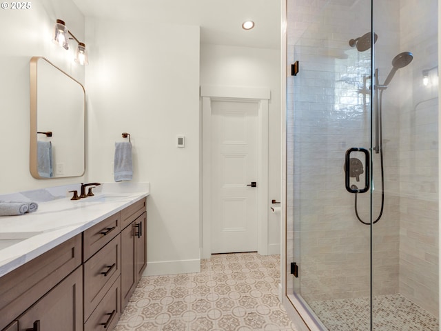 bathroom featuring vanity and an enclosed shower