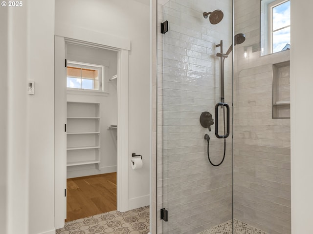 90202 Hobie Rd, Warrenton, OR 97146 - full bath featuring a shower stall, a spacious closet, and baseboards
