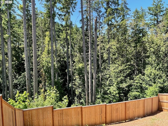 7827 SW Thornbridge Ter Unit 9, Beaverton, OR 97007 - view of yard featuring a wooded view