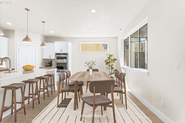 7827 SW Thornbridge Ter Unit 9, Beaverton, OR 97007 - dining area featuring light wood-style flooring, recessed lighting, and baseboards