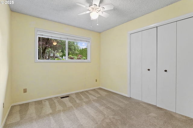 13980 Shireva Ct, Lake Oswego, OR 97034 - unfurnished bedroom featuring carpet floors, a textured ceiling, and a closet