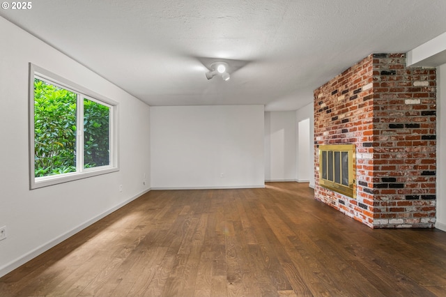 13980 Shireva Ct, Lake Oswego, OR 97034 - unfurnished living room with hardwood / wood-style flooring and a brick fireplace