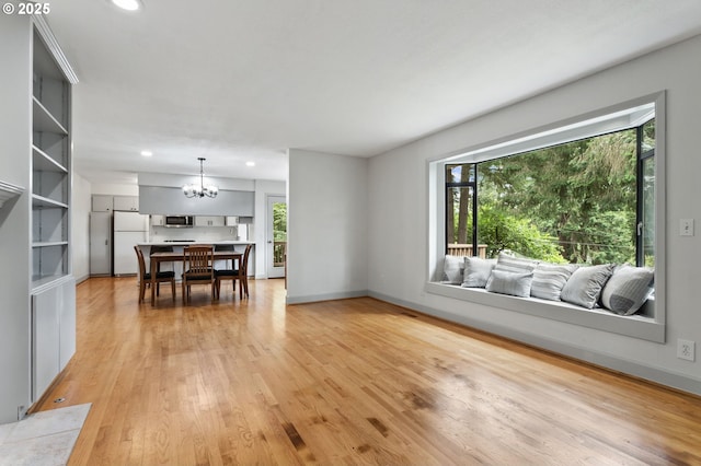 13980 Shireva Ct, Lake Oswego, OR 97034 - living area featuring a chandelier, plenty of natural light, light wood-style flooring, and recessed lighting