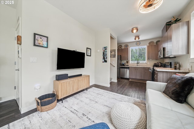 116 NE 109th Ave, Portland, OR 97220 - living area with dark wood-type flooring and baseboards