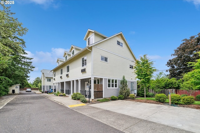 116 NE 109th Ave Unit A5, Portland, OR 97220 - view of home's exterior featuring covered porch
