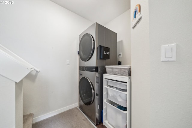 116 NE 109th Ave Unit A5, Portland, OR 97220 - laundry room featuring estacked washer and dryer, baseboards, and carpet