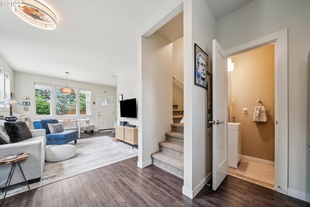 116 NE 109th Ave, Portland, OR 97220 - living area featuring stairs, dark wood-style flooring, and baseboards