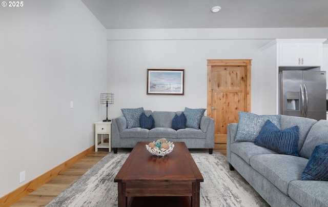 living room with light wood-style floors and baseboards