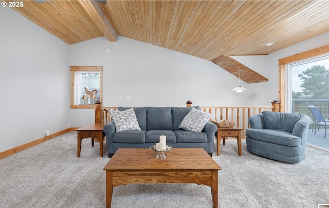 living room with vaulted ceiling with beams, carpet floors, plenty of natural light, and baseboards