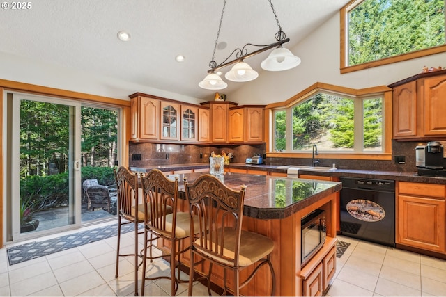 kitchen with black dishwasher, a sink, built in microwave, high vaulted ceiling, and tasteful backsplash