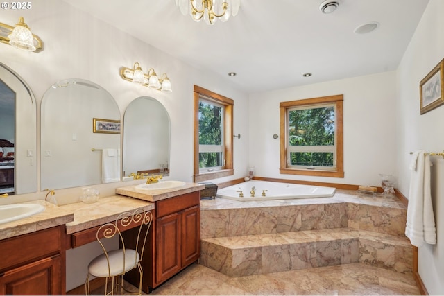 bathroom with double vanity, a garden tub, recessed lighting, and marble finish flooring
