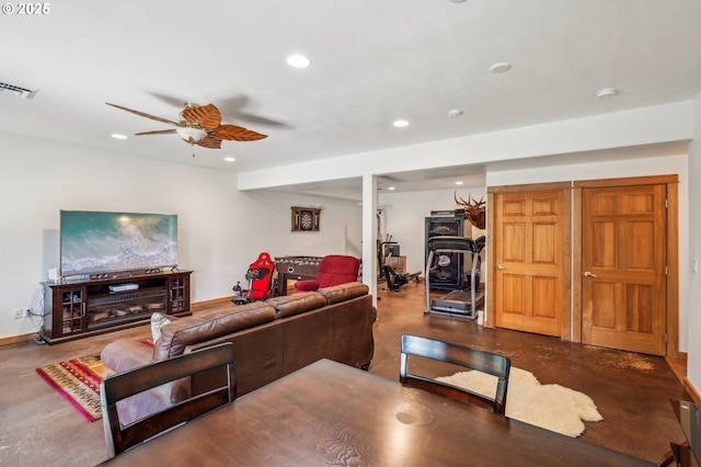 living room with recessed lighting, visible vents, finished concrete floors, ceiling fan, and baseboards