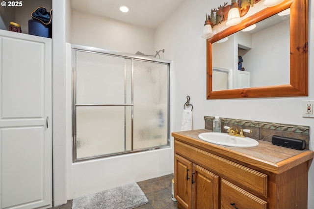 full bath featuring enclosed tub / shower combo, vanity, recessed lighting, and tile patterned floors