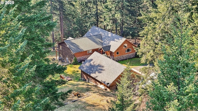 drone / aerial view featuring a forest view