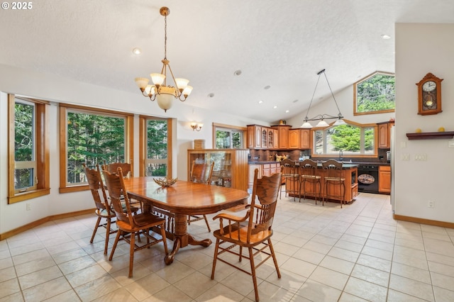 dining area with a notable chandelier, vaulted ceiling, a textured ceiling, and light tile patterned floors