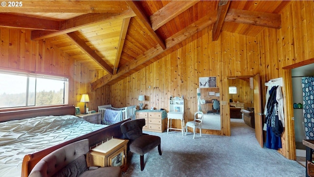 carpeted bedroom with wooden walls, lofted ceiling with beams, and wooden ceiling