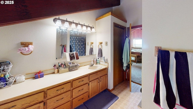 bathroom with tile patterned floors and vanity