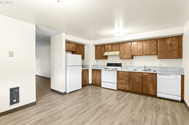 9208 NE 27th St, Vancouver, WA 98662 - kitchen with white appliances, a sink, under cabinet range hood, brown cabinets, and light countertops