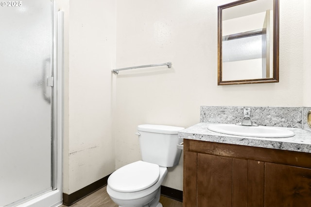 9208 NE 27th St, Vancouver, WA 98662 - full bathroom featuring vanity, a shower stall, toilet, and baseboards