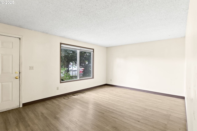 9208 NE 27th St, Vancouver, WA 98662 - unfurnished room featuring wood finished floors, a textured ceiling, and baseboards