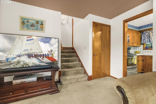 stairway with carpet floors and baseboards