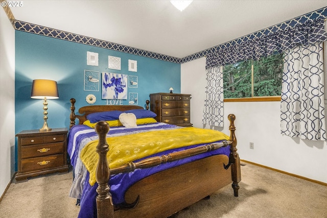 carpeted bedroom with baseboards