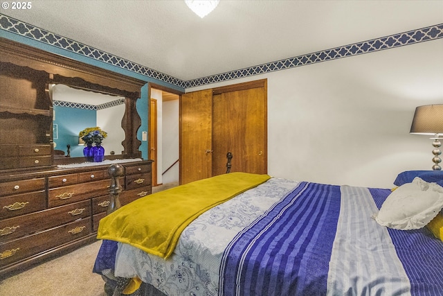carpeted bedroom featuring a closet