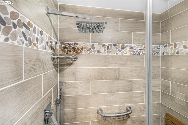 full bath featuring a tile shower