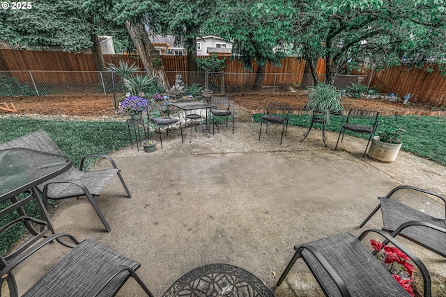 view of patio / terrace featuring a fenced backyard and outdoor dining area