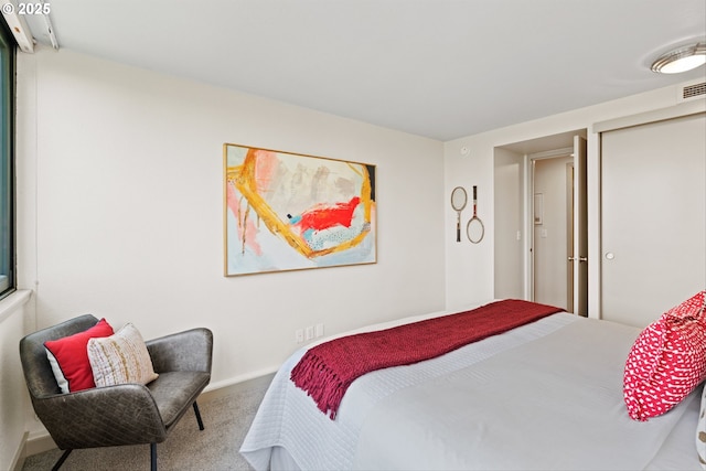 bedroom featuring carpet floors and baseboards