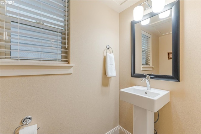 14215 SW Burlwood Ln, Beaverton, OR 97005 - bathroom featuring a sink and baseboards
