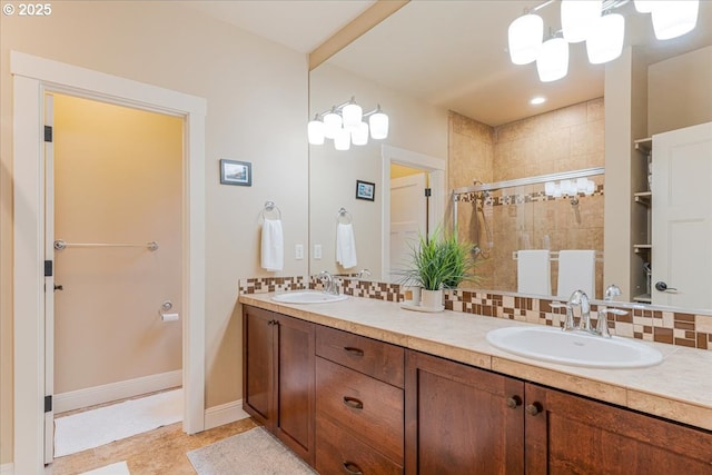14215 SW Burlwood Ln, Beaverton, OR 97005 - full bath with a sink, tasteful backsplash, a stall shower, and baseboards