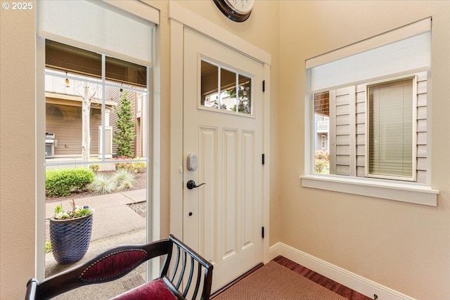 14215 SW Burlwood Ln, Beaverton, OR 97005 - foyer featuring baseboards and wood finished floors