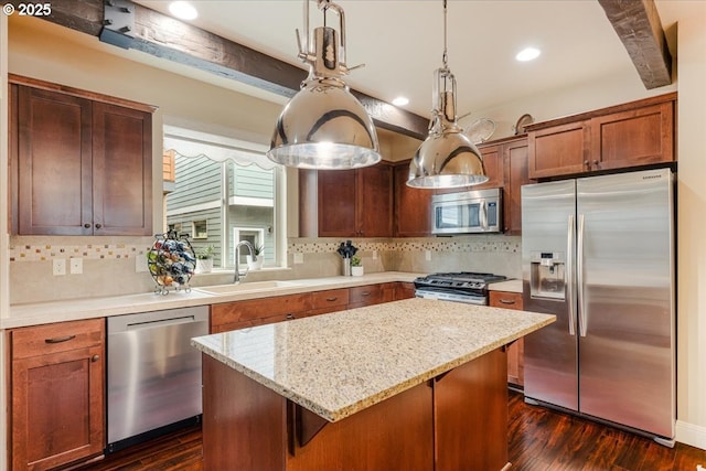 14215 SW Burlwood Ln, Beaverton, OR 97005 - kitchen with a sink, dark wood-style floors, a kitchen island, and stainless steel appliances