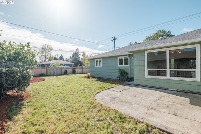 view of yard featuring fence and a patio area