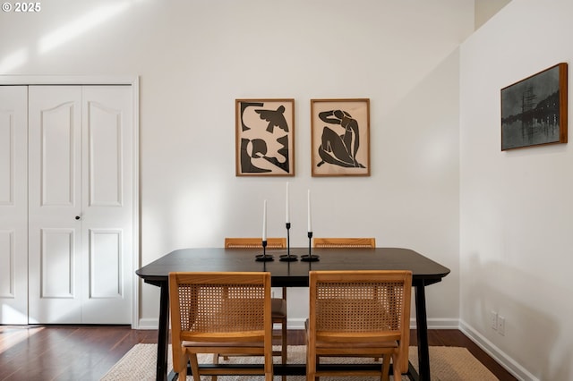 dining room featuring wood finished floors and baseboards