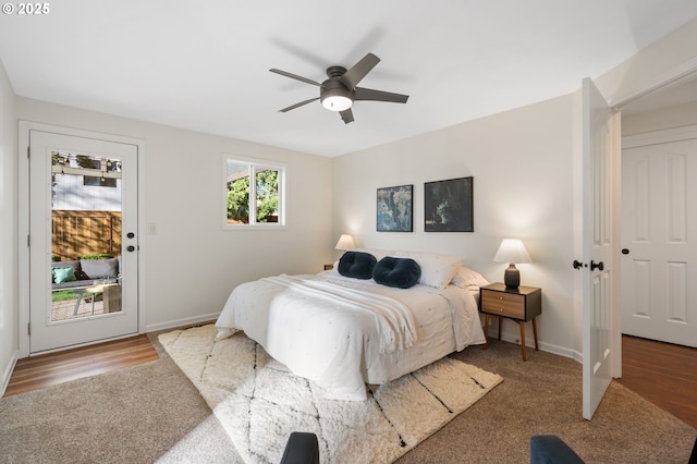 bedroom featuring access to outside, baseboards, and ceiling fan