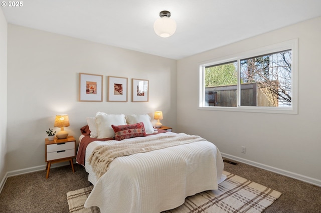 bedroom featuring visible vents, carpet flooring, and baseboards