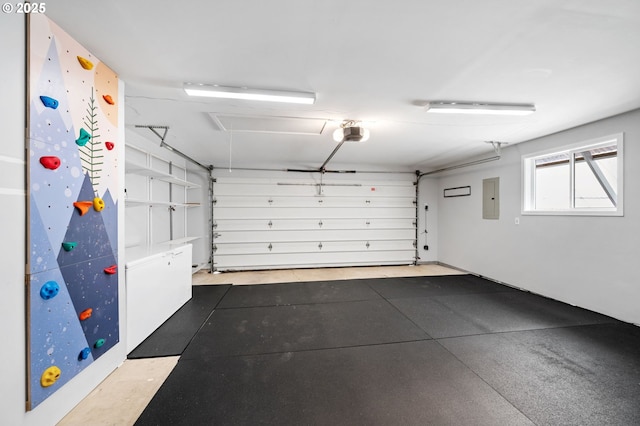 garage featuring electric panel and a garage door opener