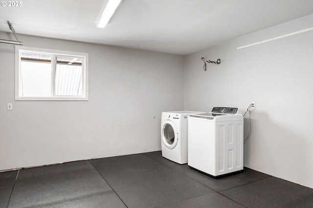 washroom featuring washer and clothes dryer and laundry area