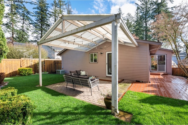 rear view of property with a patio, a yard, fence, and a pergola