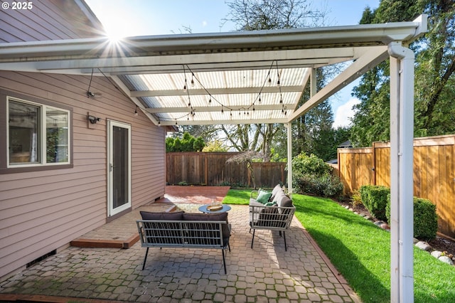 view of patio / terrace featuring an outdoor living space and a fenced backyard