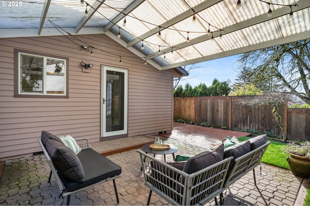 view of patio / terrace with an outdoor hangout area and fence