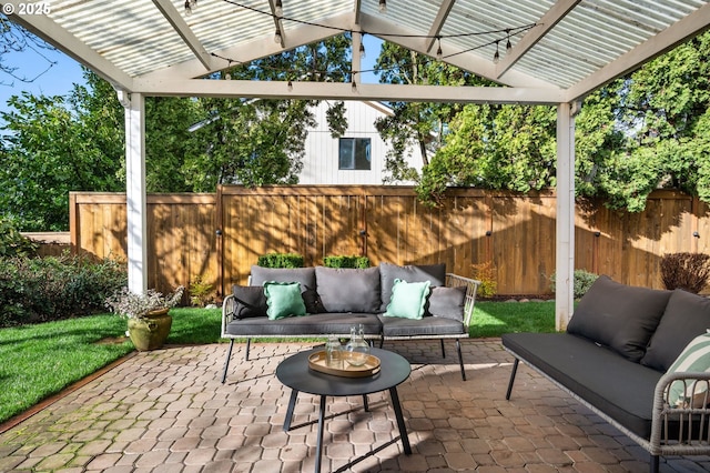 view of patio / terrace featuring an outdoor living space, a fenced backyard, and a pergola