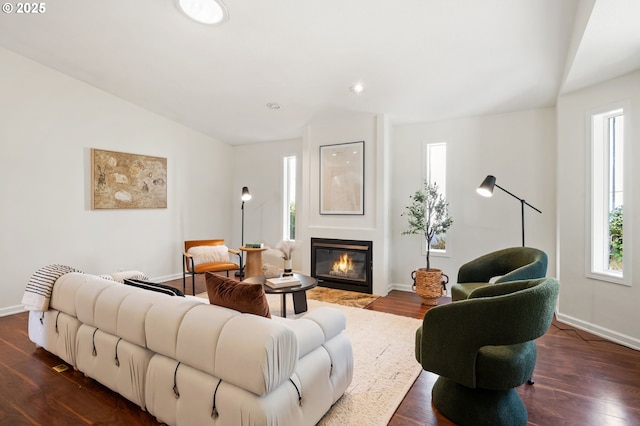 living area with dark wood-style floors and baseboards